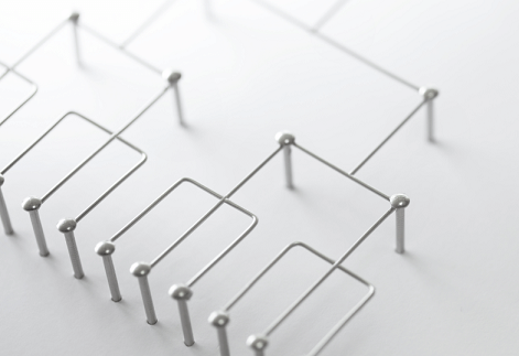 Pins linked together by thin metal