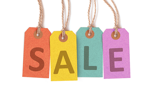 4 price tags spelling out the word sale