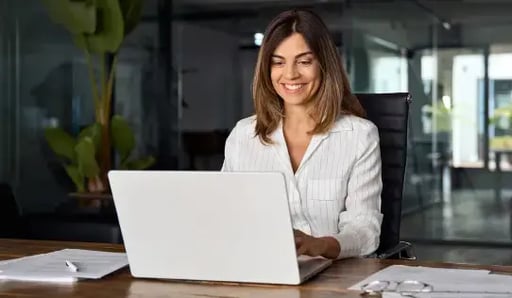 Woman smiling on laptop